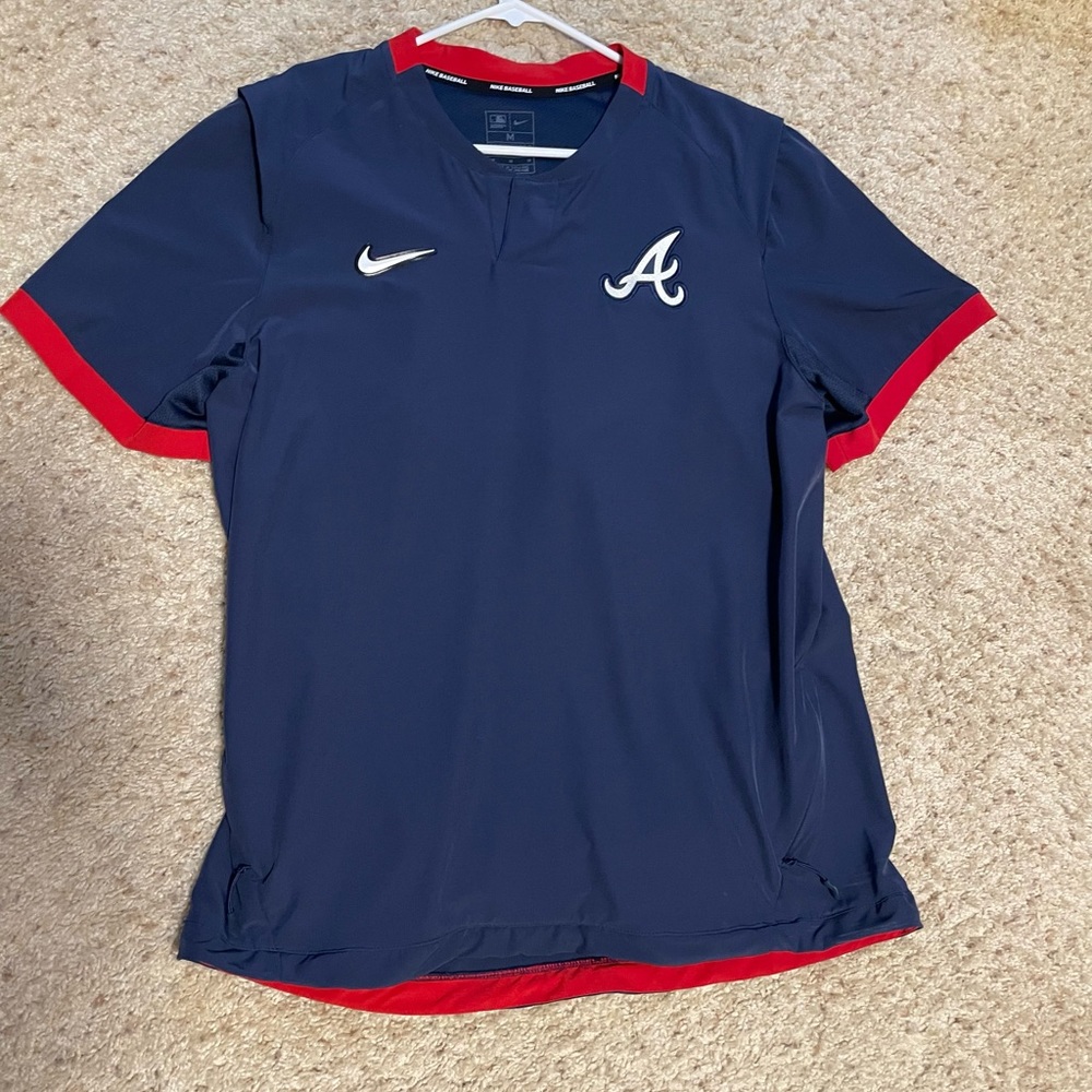 Atlanta braves team issued cage jacket.